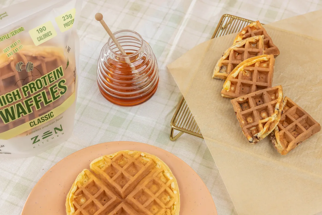Classic waffles, honey and the Zen pack on a breakfast table
