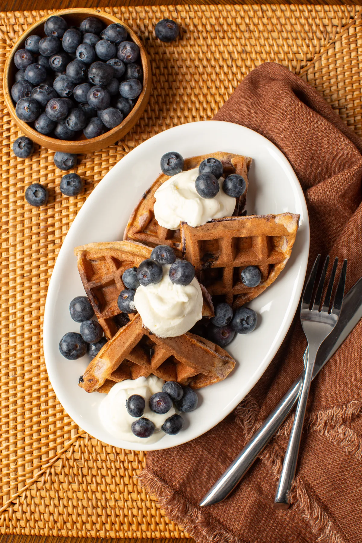 Blueberry waffles topped with fresh blueberries